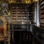 Baroque architecture and wooden shelves of the Joanina Library at the University of Coimbra, Portugal