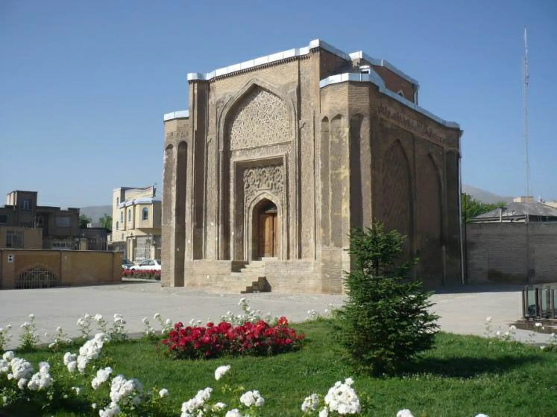 Alavian dome of Hamedan next to the green space