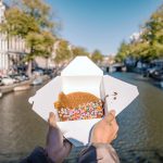 Waffles with colorful decorations on the canals of Amsterdam