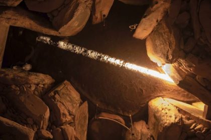 A ray of sunlight passing through a special window in the Newgrange tomb