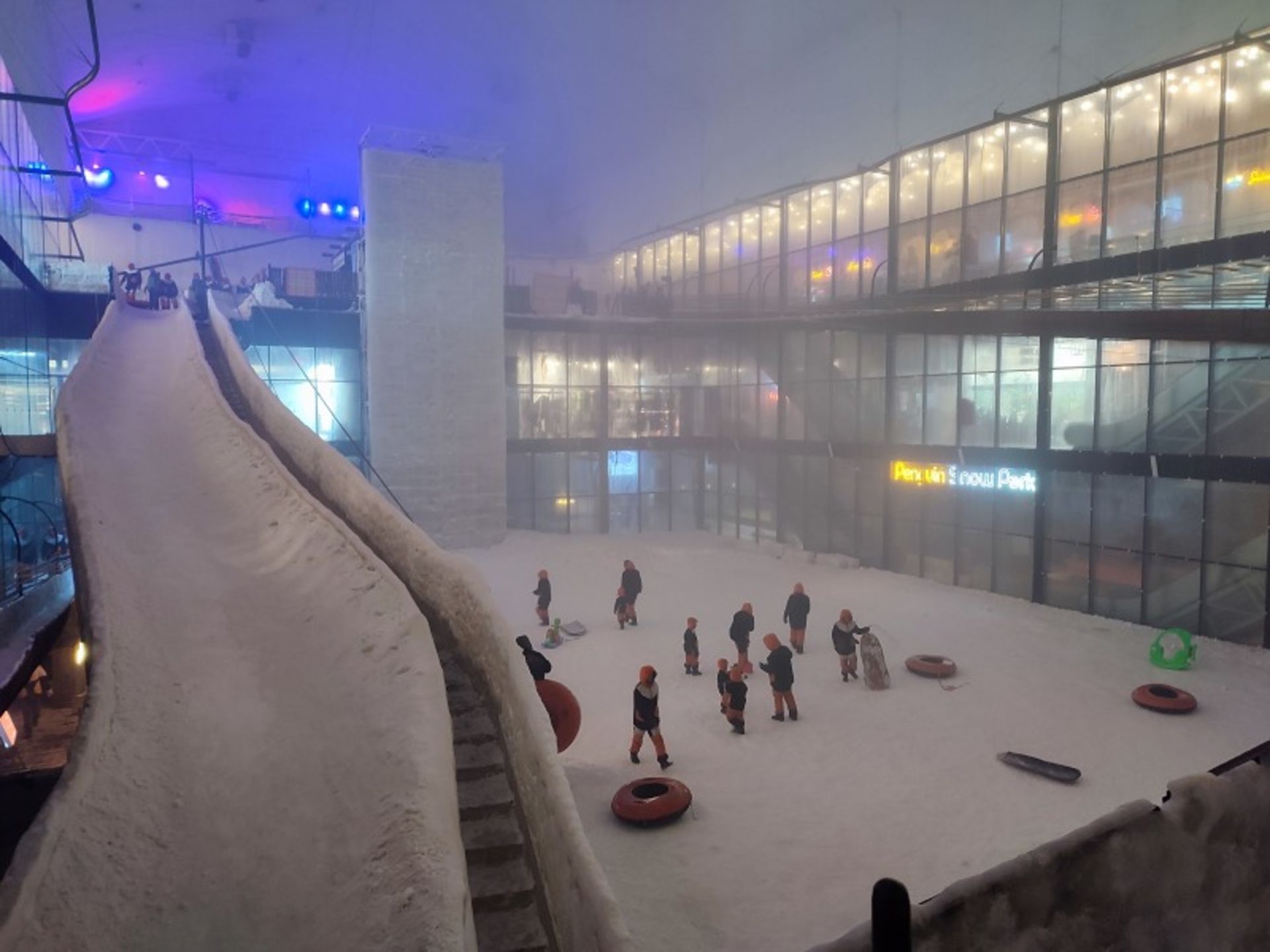 Tourists in special clothes in the interior of Kish Penguin Snow Park