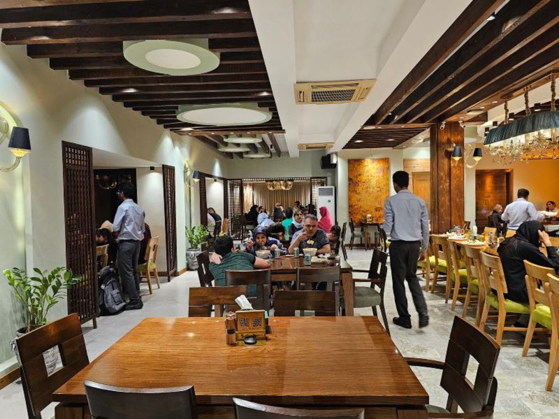 Guests in the interior of Darchin Kish cafe restaurant