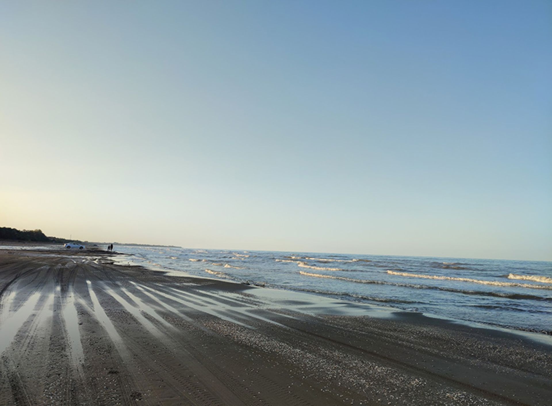 Ocean sand beach on the edge of the Caspian Sea