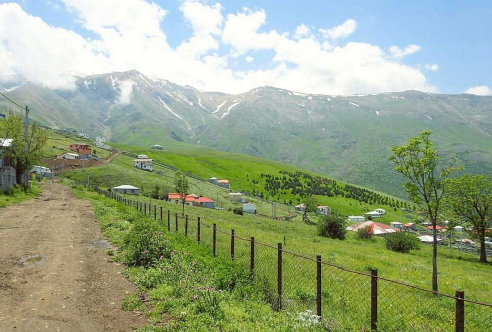 A dirt road in the middle of Javaherdasht Chabaksar plain