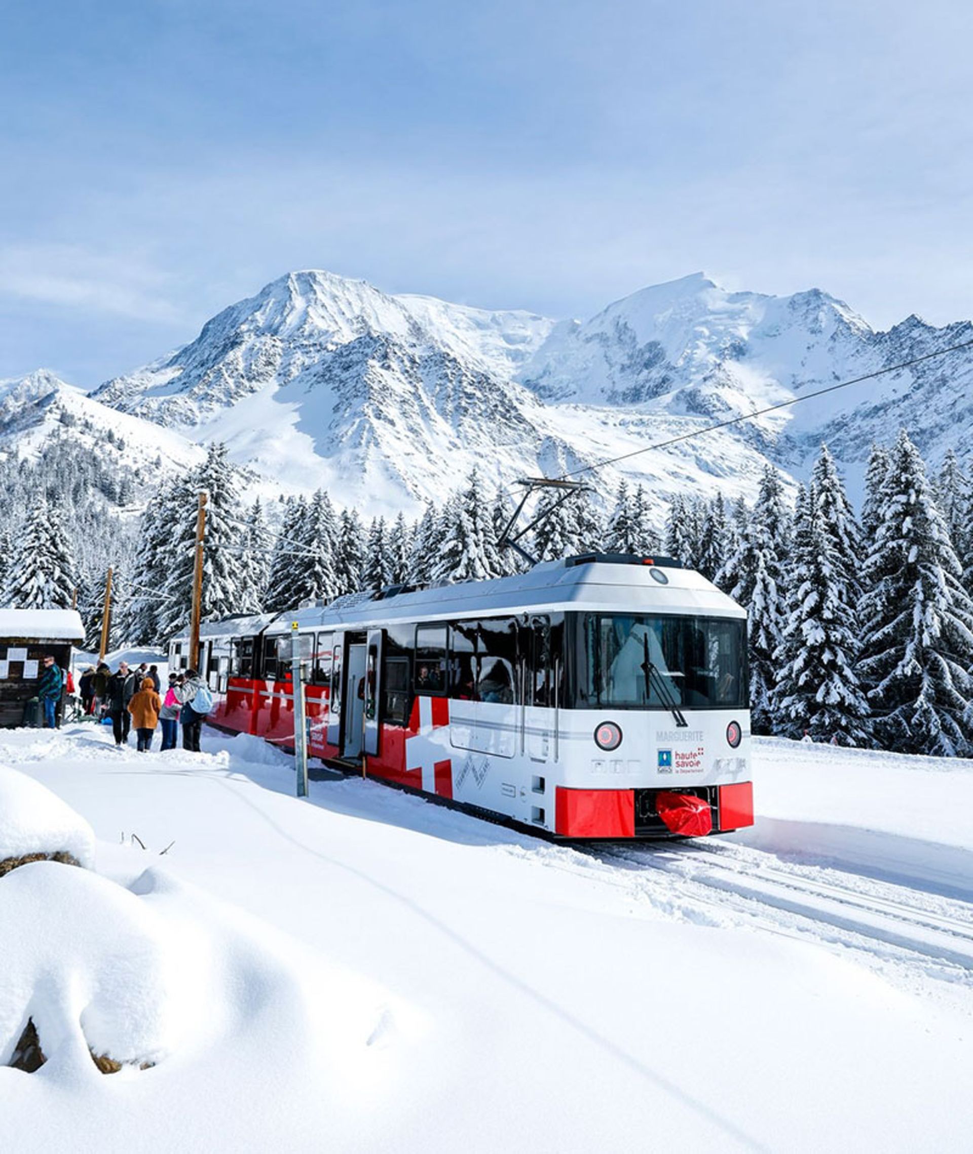 Train crossing the snowy and mountainous route in France