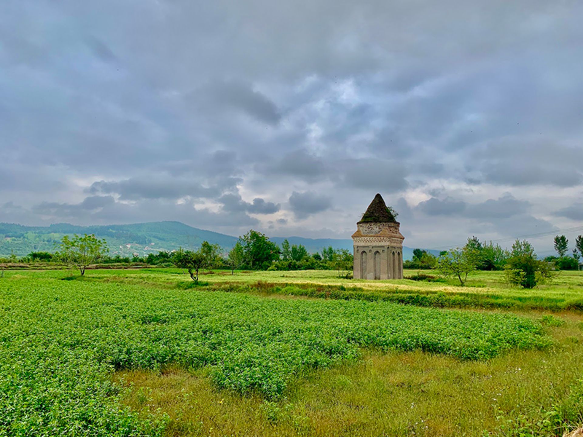 Shater Gonbad among the green fields of Sari