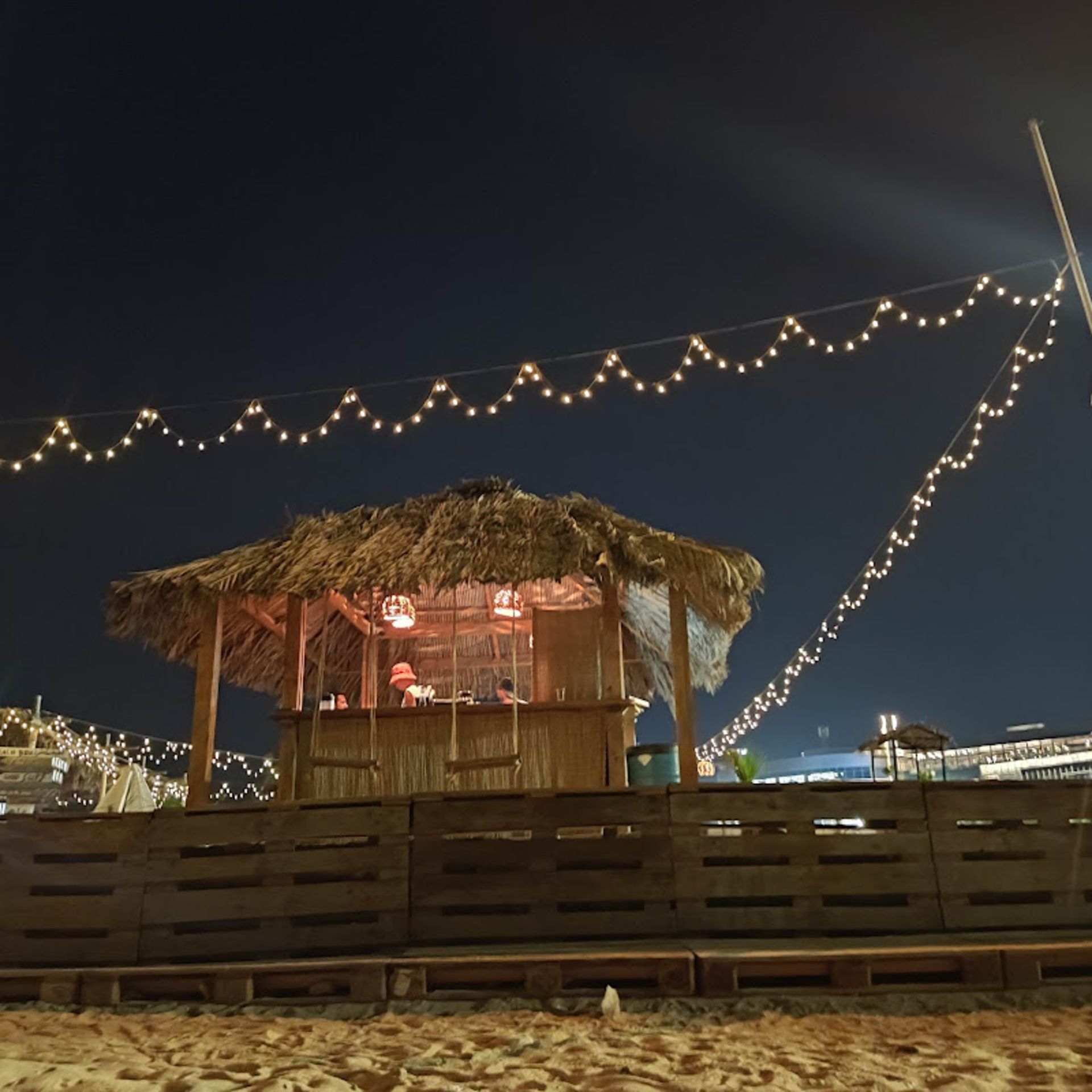Wooden gazebo in the Beach Box section of Aghanan Kish Beach