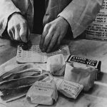 Officer stamping the ration book