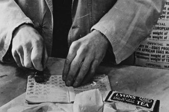 Officer stamping the ration book