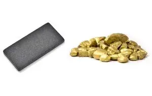 What is the gold benchmark and how does it determine the gold grade?