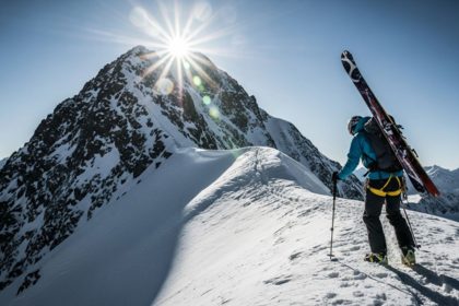 Eskimo athlete climbing a mountain