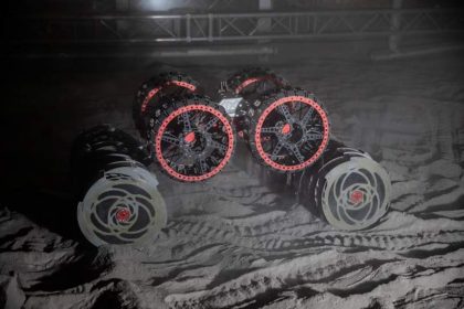 A close-up of the special wheels and drilling tanks of a lunar rover
