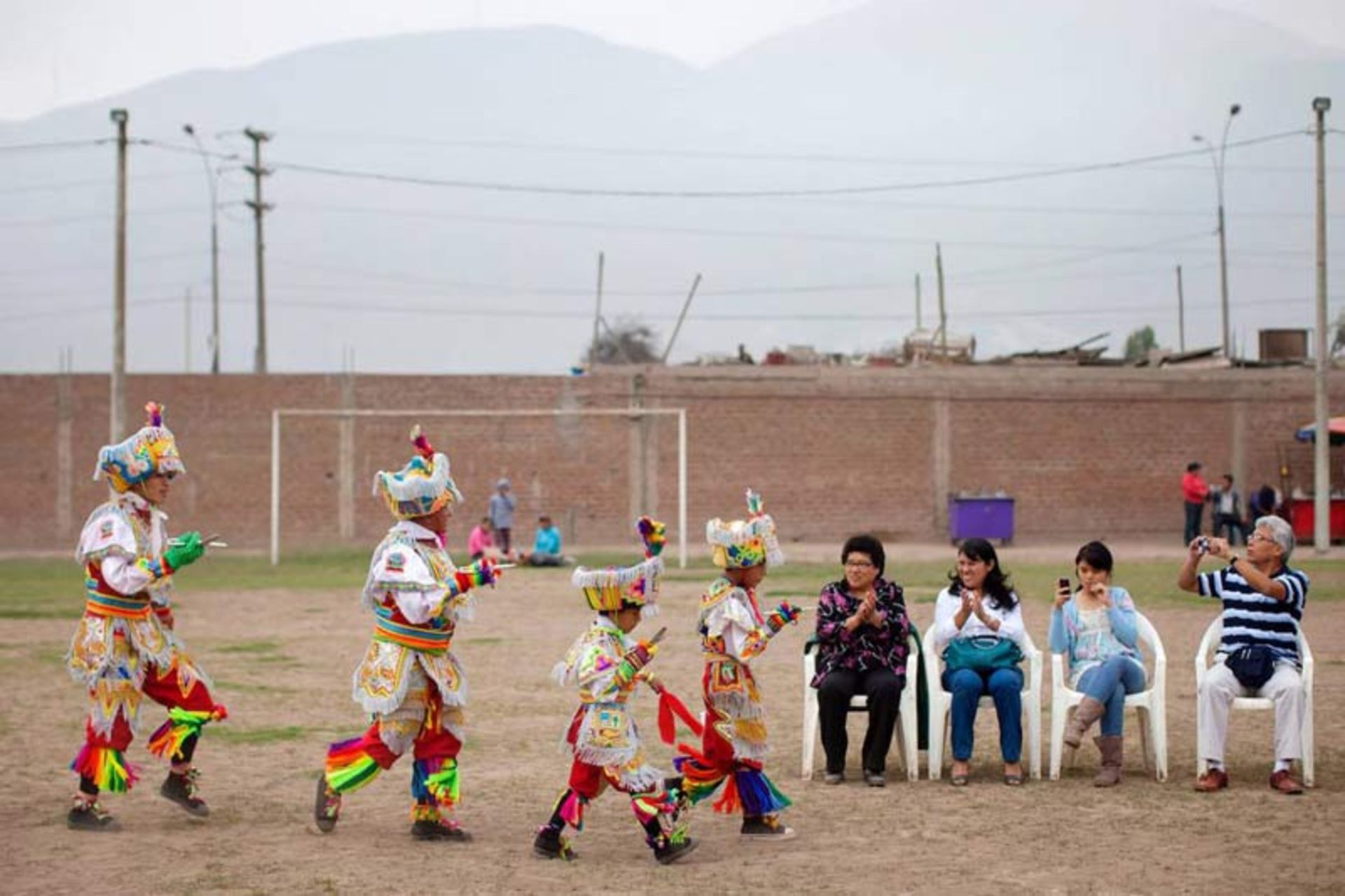 Children in colorful traditional clothes performing the 