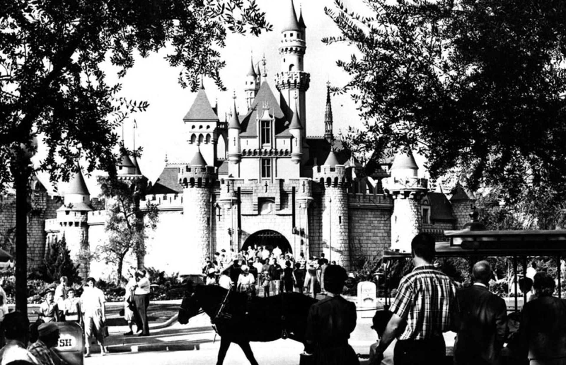 Old black and white photo of people attending Disneyland California