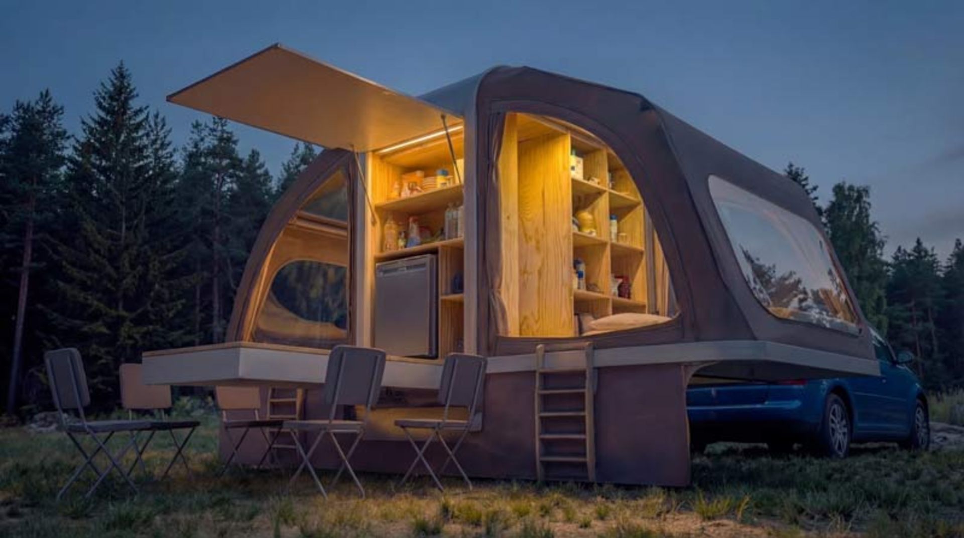 Night view of Wingcube with warm indoor lighting and ready dining table