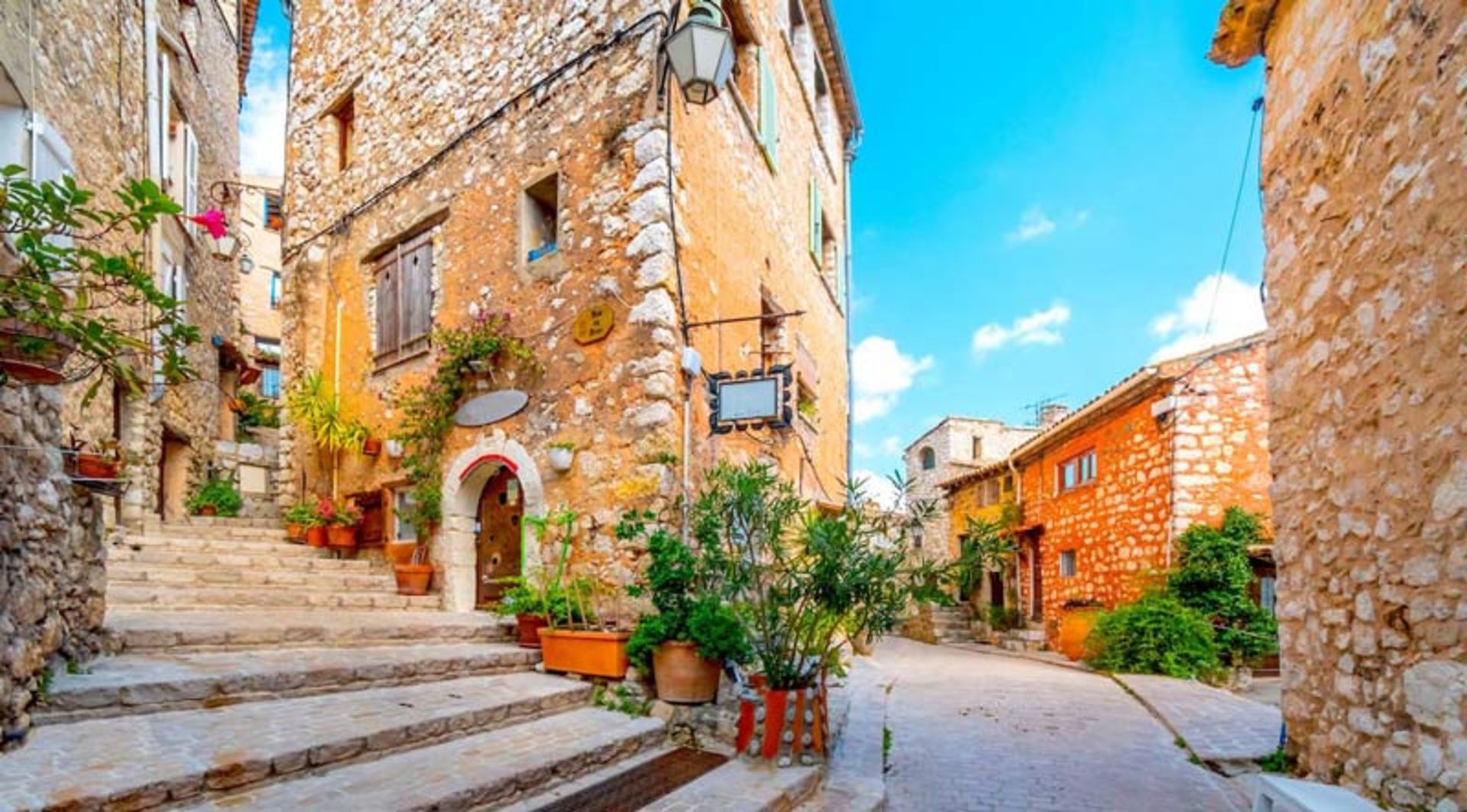 Mai is an old, stepped alley in the south of France with stone walls and decorative vases