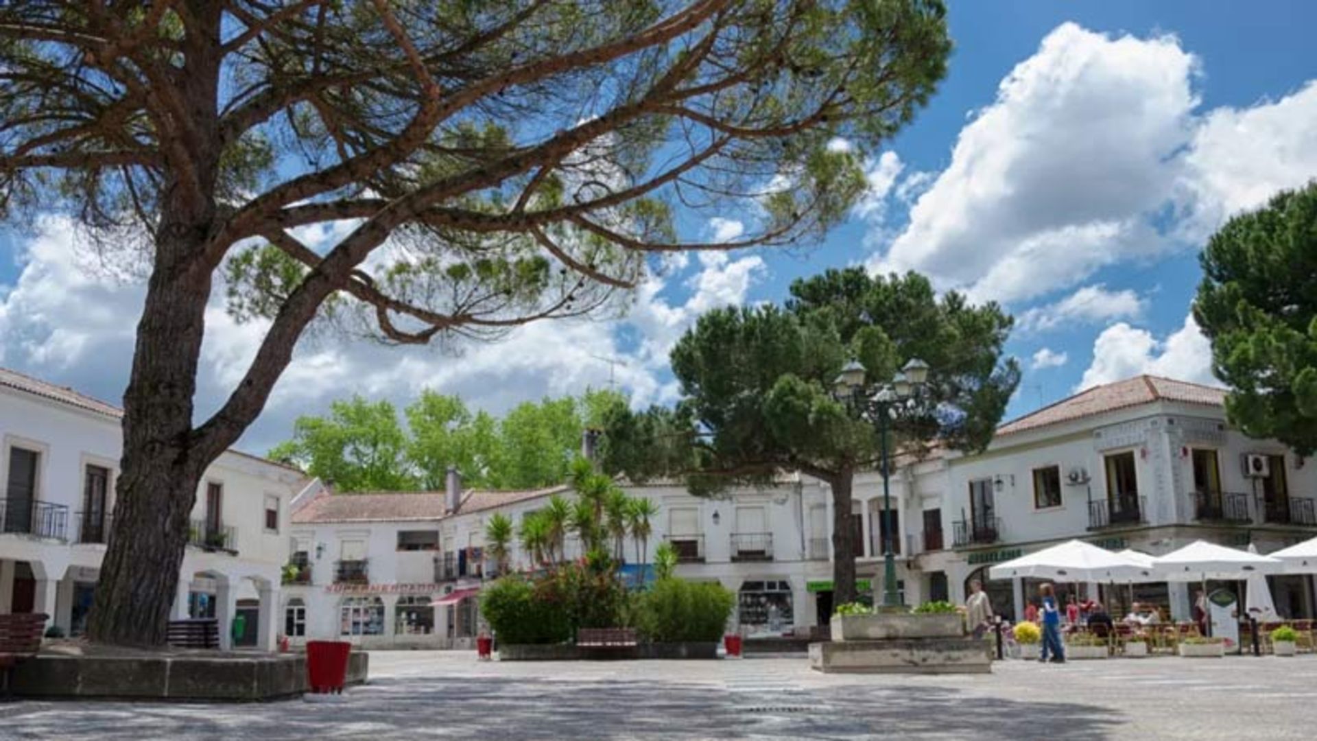 Cozy stone square in a small town in Portugal, with classic white buildings