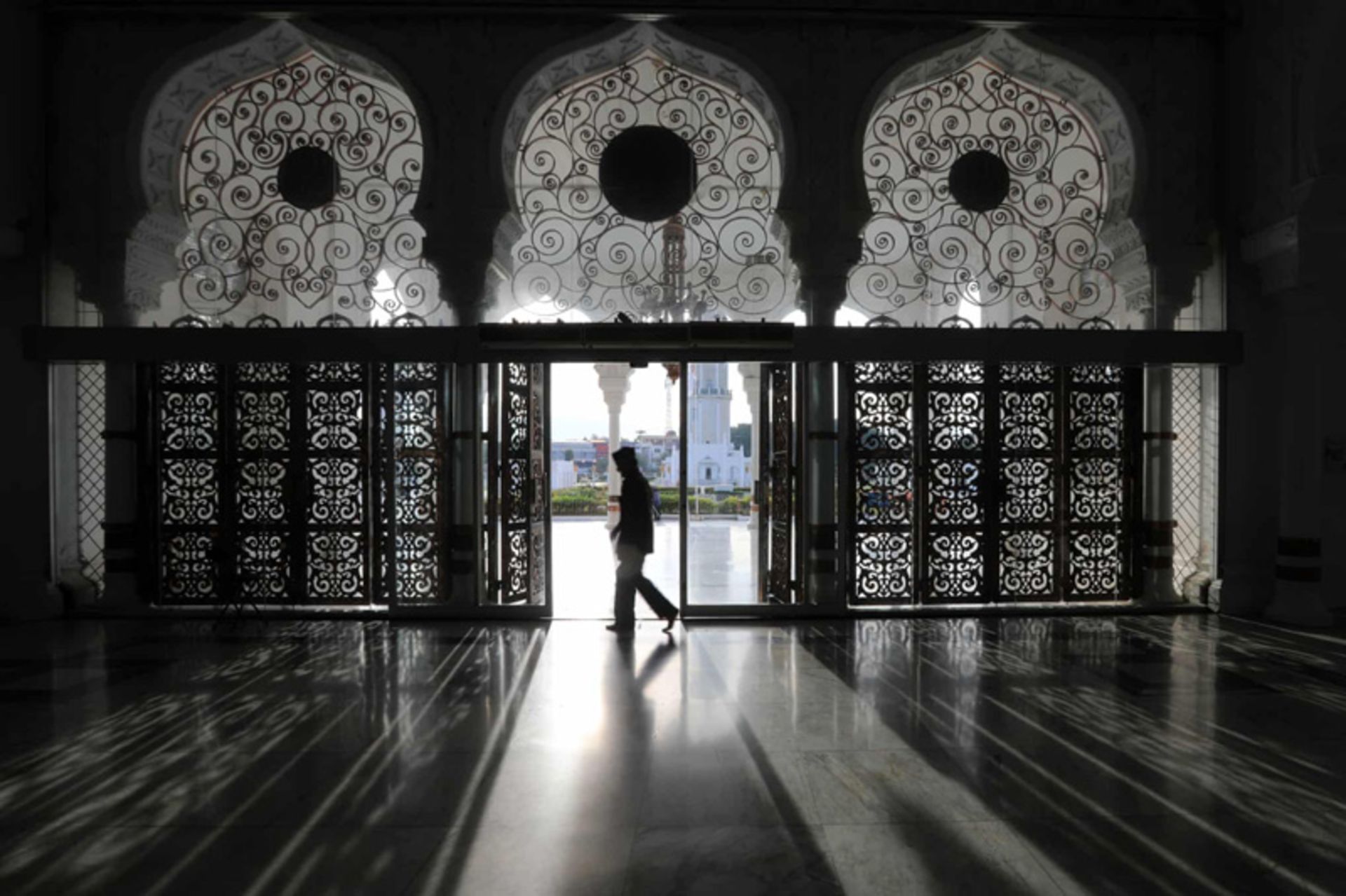 A worshiper walking in an Indonesian mosque
