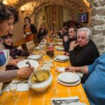 A woman serving soup at the Panarda festival
