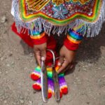 An image of scissors in the hands of a dancer