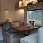 Cozy and minimal dining space inside the renovated luxury caravan
