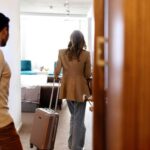 Entering passengers with wheeled luggage into the hotel room